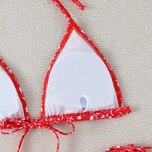 Detail of red floral bikini top with removable pads and soft white inner lining