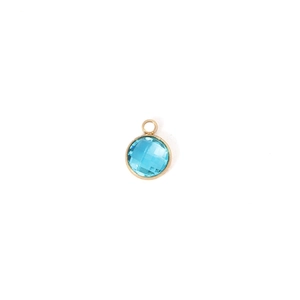 Detailed view of 7mm round gold-rimmed blue faceted birthstone pendant with loop