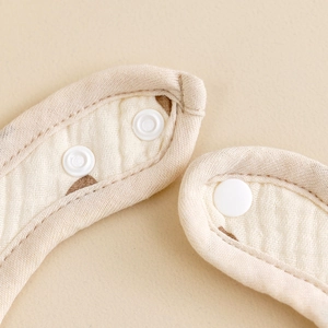 U-shaped six-layer cotton gauze baby bib with adjustable plastic snaps in beige