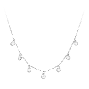 Close-up of minimalist S925 sterling silver necklace with seven zircon stone pendants