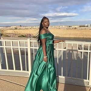 Elegant off-shoulder emerald green satin prom dress with a high waist and a long slit