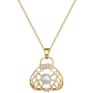 Elegant gold titanium necklace featuring a hollow handbag pendant with pearl and crystals