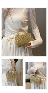 Detail of gold rhinestone evening clutch with tassel fringe and metal ring handle
