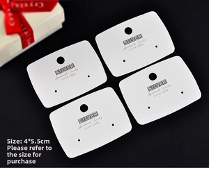 Detailed view of four white jewelry display cards for earrings and necklaces, size 4x5.5cm
