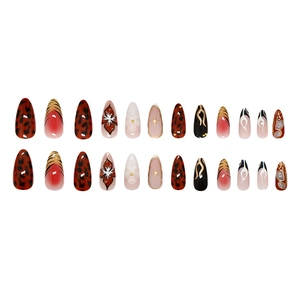Red-brown leopard and floral print press-on almond nails with 3D metallic accents