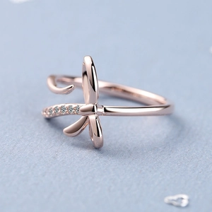 Elegant rose gold bow ring with crystal pavé accents on a minimalist open band