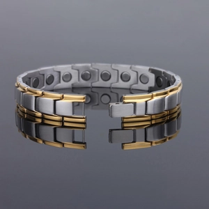 Men's magnetic steel bracelet in silver and gold tones with interior magnets