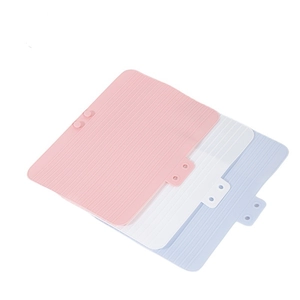 Heat resistant silicone mat for curling irons in pink, white, and light blue colors