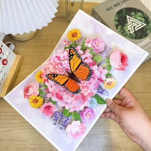 3D greeting card featuring a detailed orange monarch butterfly on pink hydrangeas flowers