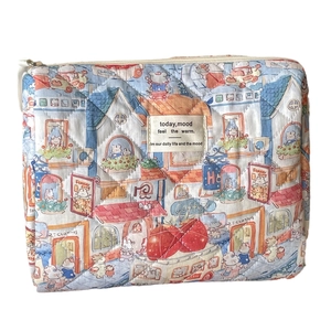 Quilted cotton makeup bag with cute cartoon rabbit print and metal zipper closure