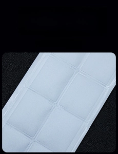 Macro view of transparent self-adhesive jewelry padding stickers on black leather