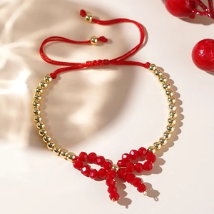 Bracciale di perline placcato oro 18 carati con fiocco rosso e cordino regolabile