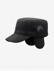 Detail view of winter flat top cap with foldable ear flaps and leather trim