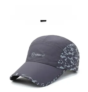 Detail of grey quick-dry baseball cap featuring breathable mesh and camo edge patterns
