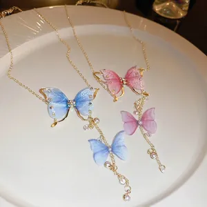 Elegant butterfly tulle fringe necklace with sparkling diamonds and pearls in gold finish