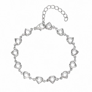 Detailed shot of silver heart link bracelet with sparkling crystals and lobster clasp