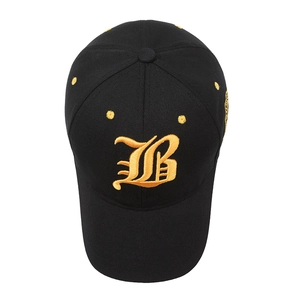 Black cotton baseball cap featuring a large golden gothic letter B embroidery on top