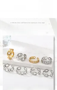Detail of adjustable 18k gold plated titanium steel chain rings in gold and silver