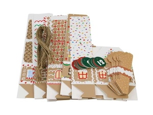 Set of Christmas advent house gift boxes with numbered tags and natural twine string
