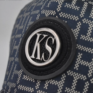 Classic checkered baseball cap in navy blue with monogram pattern and metal KS logo