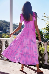Detail of pink and blue checkered summer sundress with tiered skirt and lace-up straps