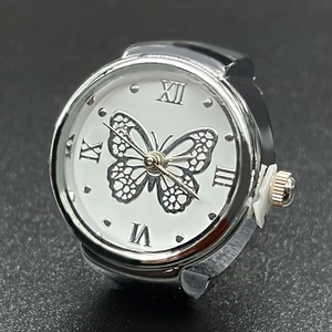 Polished silver metal ring watch featuring a white butterfly dial and Roman numerals