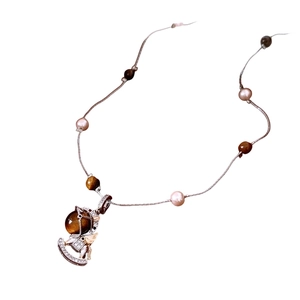 Tiger eye stone rocking horse pendant necklace with pink pearls on a vintage chain