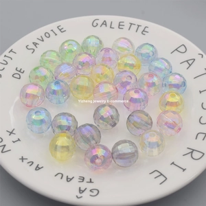 Close-up of AB coated faceted beads for DIY jewelry making in a decorative ceramic dish