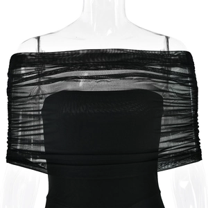Close-up of black mesh pleated detail and backless design on the slim fit dress