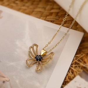 Exquisite gold butterfly necklace with blue floral gems and zircon accents on fine chain