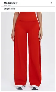 Detail shot of bright red high-waisted wide leg athletic pants with premium brushed texture