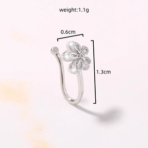 Detail view of silver star nose stud with dimensions 1.3cm length and 0.6cm width