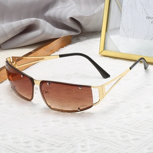 Golden hollow metal square sunglasses with brown gradient lenses in futuristic Y2K style