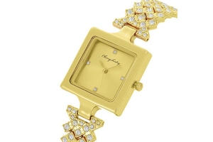 Close-up of square gold watch face with rhinestones on the decorative bracelet band