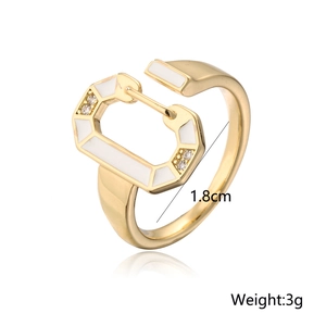 Detail view of 18K gold plated ring with white enamel and 1.8cm diameter mark