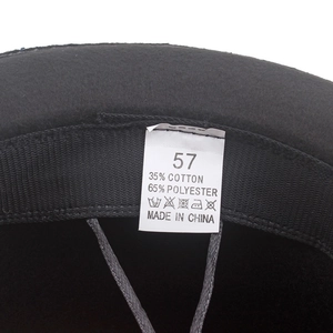 Detailed view of hat label showing size 57 and 35% cotton 65% polyester material