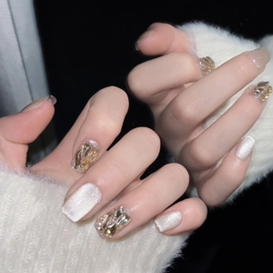 Handmade luxury cat-eye press-on nails with sparkling champagne crystals for autumn
