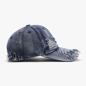 Vintage distressed blue denim baseball cap with frayed details and adjustable strap