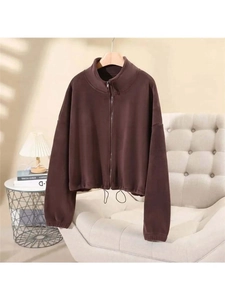 Detail of dark brown fleece jacket featuring stand collar and adjustable drawstring hem