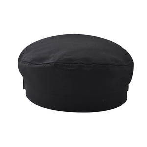 Vue détaillée d'une casquette gavroche noire en coton avec surpiqûres circulaires épurées
