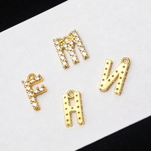 Gold-plated letter pendants M, N, F, H with sparkling micro-pave crystals