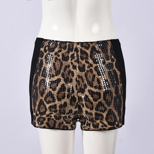 Detail of leopard print sequin shorts with black elastic side panels on mannequin