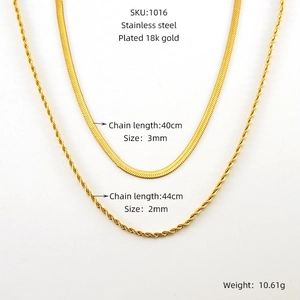 Detail view of 18k gold plated stainless steel snake and twist rope chain necklaces