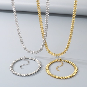 Unisex wheat chain necklace and bracelet set in gold and silver finish with heart links
