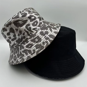 Detail of grey leopard print and black bucket hats featuring multi-row brim stitching