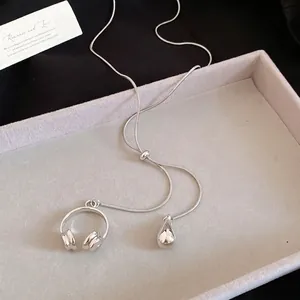 Tiger eye pearl necklace with silver snake chain featuring headphone and waterdrop pendants