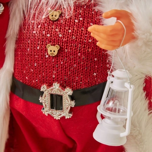 Standing Santa Claus doll decoration with knitted sequined clothes and lantern detail