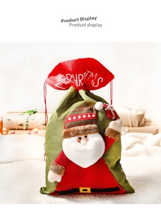 Detail view of green Christmas drawstring gift bag with 3D Santa Claus plush decor