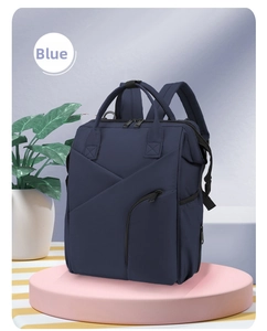 Detail view of large capacity waterproof navy blue diaper bag on display stand
