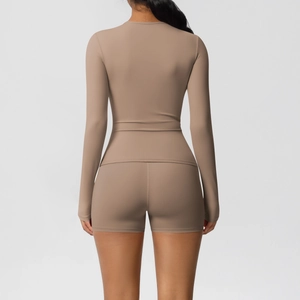 Rear view of brown two-piece high-waist sports set showing elastic compression and slim fit